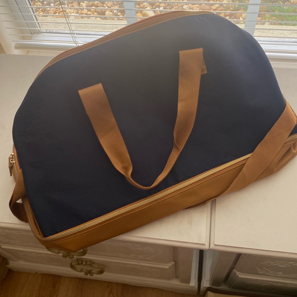 Blue and Tan duffle bag